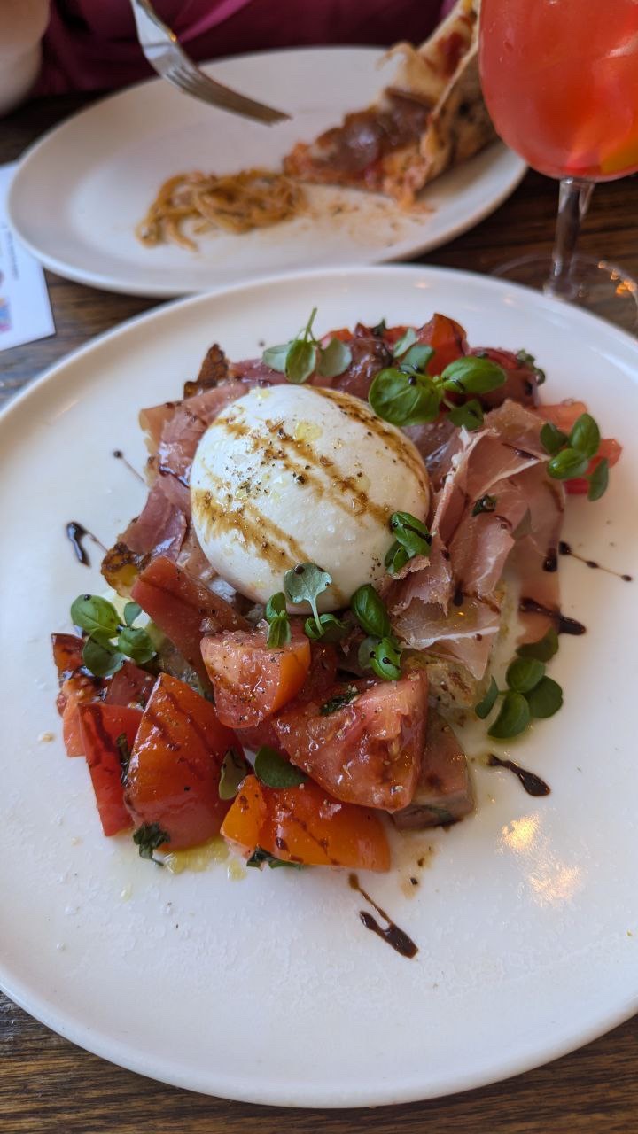 Burrata with prosciutto, tomato, basil, and balsamic