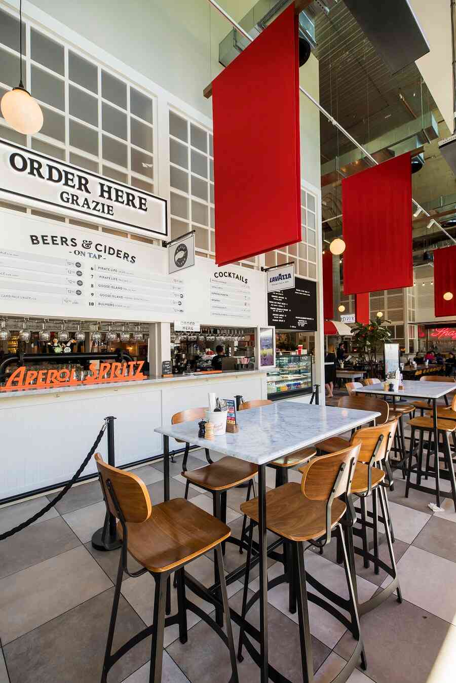 Fratelli Fresh Darling Harbour dining room with red banners and bar seating